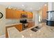 Well-equipped kitchen featuring granite countertops, stainless steel appliances, and ample cabinet space at 6453 Alcalde Ct # 110, Orlando, FL 32835