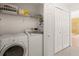Functional laundry room with modern washer and dryer units at 6453 Alcalde Ct # 110, Orlando, FL 32835