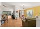 Inviting living room with hardwood floors, comfortable seating, and plenty of natural light at 6453 Alcalde Ct # 110, Orlando, FL 32835