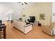 Bright living room with wood floors, high ceilings, and comfortable seating at 6453 Alcalde Ct # 110, Orlando, FL 32835