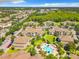Aerial shot showcasing community pool, lush landscaping, and residential buildings, creating a resort-style living environment at 6524 Swissco Dr # 1012, Orlando, FL 32822