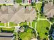An aerial view of the community rooftops, green spaces, and walkways in an apartment complex at 6524 Swissco Dr # 1012, Orlando, FL 32822
