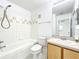 Cozy bathroom with a shower-tub combo, single vanity, and a neutral color scheme at 6524 Swissco Dr # 1012, Orlando, FL 32822