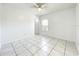Bright bedroom features a tiled floor, ceiling fan, and plenty of natural light at 6524 Swissco Dr # 1012, Orlando, FL 32822