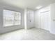 Bedroom featuring marble tile, one window, and closet at 6524 Swissco Dr # 1012, Orlando, FL 32822