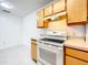 Cozy kitchen with white range stove and ample cabinet space for cooking needs at 6524 Swissco Dr # 1012, Orlando, FL 32822
