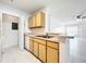 Kitchen shows stainless steel dishwasher, light countertops and classic wood cabinets at 6524 Swissco Dr # 1012, Orlando, FL 32822
