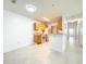 Open kitchen boasts stainless steel appliances, tile floors, and bright lighting at 6524 Swissco Dr # 1012, Orlando, FL 32822
