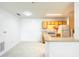 Bright kitchen features white appliances and cabinets with a breakfast bar at 6524 Swissco Dr # 1012, Orlando, FL 32822