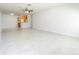 Spacious open-plan living area with marble tile flooring connected to kitchen at 6524 Swissco Dr # 1012, Orlando, FL 32822