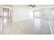 Bright, spacious living room with marble tile flooring and natural light from a window at 6524 Swissco Dr # 1012, Orlando, FL 32822