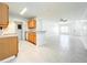 Open layout connecting the kitchen and living area, featuring marble tile flooring at 6524 Swissco Dr # 1012, Orlando, FL 32822