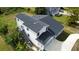 Aerial view of new home featuring a spacious backyard, a balcony, and a covered porch at 9122 Trevarthon Rd, Orlando, FL 32817