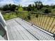 Balcony with a metal railing, overlooking a lush green landscape at 9122 Trevarthon Rd, Orlando, FL 32817
