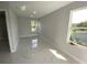 Bright, airy bedroom with two large windows and marble floors at 9122 Trevarthon Rd, Orlando, FL 32817