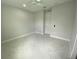 Neutral bedroom with marble floors, ceiling fan and a door at 9122 Trevarthon Rd, Orlando, FL 32817
