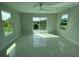Bedroom with a ceiling fan, natural light, and sliding glass doors to the outside at 9122 Trevarthon Rd, Orlando, FL 32817