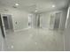 Spacious bedroom showcasing a walk-in closet, marble floors, ceiling fan and natural light at 9122 Trevarthon Rd, Orlando, FL 32817