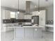 New kitchen featuring granite countertops, stainless steel appliances, white cabinets and an island at 9122 Trevarthon Rd, Orlando, FL 32817