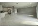 Expansive living room with marble floors, recessed lights and an open view of the modern kitchen at 9122 Trevarthon Rd, Orlando, FL 32817