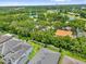Aerial view of home with a large yard and lake views at 9275 Lake Sharp Ct, Orlando, FL 32817