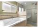 This bathroom features a large soaking tub and glass enclosed shower at 9275 Lake Sharp Ct, Orlando, FL 32817