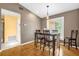 Cozy dining area with a window overlooking the front yard, adjacent to the kitchen at 9275 Lake Sharp Ct, Orlando, FL 32817