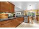 A view of the kitchen featuring granite countertops, a sink and stainless steel dishwasher at 9275 Lake Sharp Ct, Orlando, FL 32817