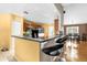 Modern kitchen features sleek countertops, stainless appliances, and an adjacent breakfast bar at 9275 Lake Sharp Ct, Orlando, FL 32817