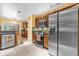 This kitchen features stainless steel appliances, tile floors and green backsplash at 9275 Lake Sharp Ct, Orlando, FL 32817