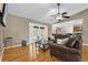 Spacious living room with hardwood floors, and an open design flowing into the kitchen area at 9275 Lake Sharp Ct, Orlando, FL 32817