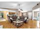 Bright living room featuring hardwood floors and an open layout with views of the kitchen at 9275 Lake Sharp Ct, Orlando, FL 32817