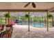 Relaxing screened pool area with outdoor furniture at 9275 Lake Sharp Ct, Orlando, FL 32817