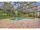 Screened pool with a beautiful backyard garden at 9275 Lake Sharp Ct, Orlando, FL 32817