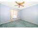 Bedroom with carpet floors, ceiling fan, and a window at 1017 Gould Pl, Oviedo, FL 32765