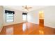 Spacious main bedroom with hard wood floors and two windows with bathroom attached at 1017 Gould Pl, Oviedo, FL 32765