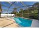 Private backyard pool features screened enclosure and lush landscaping at 1017 Gould Pl, Oviedo, FL 32765