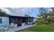 Large backyard features a covered patio and ample green space perfect for outdoor enjoyment and relaxation at 10928 Tangora St, Orlando, FL 32825