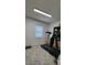 Picture showcases the basement area including storage shelves and a treadmill at 10928 Tangora St, Orlando, FL 32825