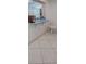 Breakfast bar with a light blue countertop and white wooden chair at 10928 Tangora St, Orlando, FL 32825