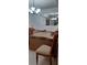 Dining room filled with moving boxes under a chandelier and mirror at 10928 Tangora St, Orlando, FL 32825
