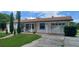 Attractive home with an attached garage, stone accents, and well-maintained front lawn at 10928 Tangora St, Orlando, FL 32825