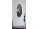 Close-up of the front door with decorative glass and a smart lock at 10928 Tangora St, Orlando, FL 32825