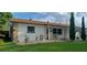 Attractive home featuring stone detailing, a manicured lawn, and a welcoming facade at 10928 Tangora St, Orlando, FL 32825