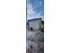 View of detached garage with rolling door and concrete driveway at 10928 Tangora St, Orlando, FL 32825