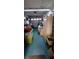 Image shows a garage filled with clutter and storage items at 10928 Tangora St, Orlando, FL 32825