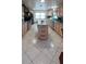 Spacious kitchen featuring light wood cabinets, tile floors and an island at 10928 Tangora St, Orlando, FL 32825