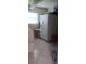 Laundry room with appliances, tile flooring, and window at 10928 Tangora St, Orlando, FL 32825