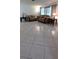 Spacious living room with ample seating and tile flooring at 10928 Tangora St, Orlando, FL 32825
