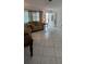 Cozy living room with tile flooring and a comfortable floral patterned sofa at 10928 Tangora St, Orlando, FL 32825